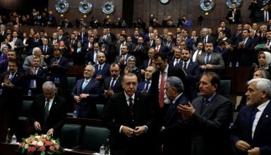 Turkey's President Tayyip Erdogan leaves his seat to address members of parliament from his ruling AK Party (AKP) during a meeting at the Turkish parliament in Ankara, Turkey, January 9, 2018. REUTERS/Umit Bektas