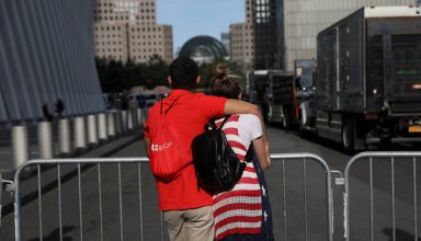 A couple pauses as they embrace on a street outside the National 9/11 Memorial and Museum during ceremonies marking the 16th anniversary of the September 11, 2001 attacks in New York, U.S., September 11, 2017.  REUTERS/Shannon Stapleton