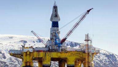 A floating oil rig in harbour in northern norway in winter