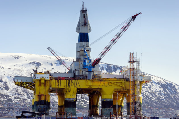 A floating oil rig in harbour in northern norway in winter
