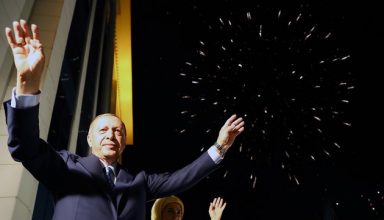 ANKARA, TURKEY - JUNE 25: President of Turkey and leader of the Justice and Development Party (AK Party) Recep Tayyip Erdogan (L) and his wife Emine Erdogan (R) greet the crowd from the balcony of the ruling AK Party's headquarters as fireworks illuminate the sky following his election success in presidential and parliamentary elections in Ankara, Turkey on June 25, 2018.
(Photo by Kayhan Ozer/Anadolu Agency/Getty Images)