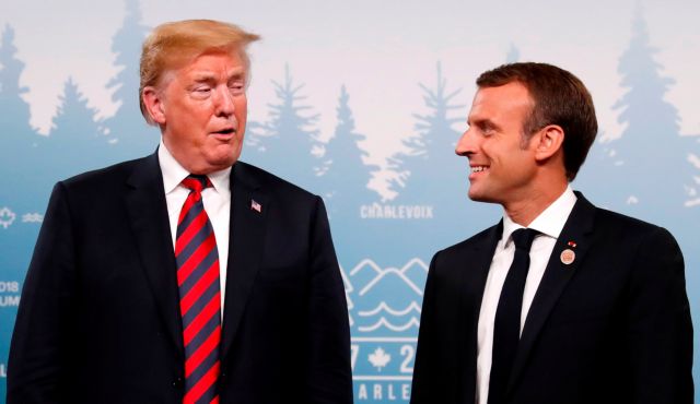 U.S. President Donald Trump talks with France's President Emmanuel Macron in a bilateral meeting at the G7 Summit in in Charlevoix, Quebec, Canada, June 8, 2018. REUTERS/Leah Millis