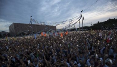 epa06816896 Supporters of imprisoned Selahattin Demirtas, Presidential candidate of People's Democratic Party (HDP), watching Selahattin Demirtas' state broadcast TRT speech on the huge screen during an election campaign rally in Istanbul, Turkey, 17 June 2018. Turkish President Erdogan announced on 18 April 2018 that Turkey will hold snap elections on 24 June 2018. The presidential and parliamentary elections were scheduled to be held in November 2019, but government has decided to change the date following the recommendation of the Nationalist Movement Party (MHP) leader Devlet Bahceli  EPA/SEDAT SUNA
