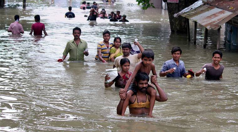 Balurghat: Flood affeccted villagers shift to safer places near Balurghat in South Dinajpur district of West Bengal on Tuesday. PTI Photo (PTI8_15_2017_000190B)