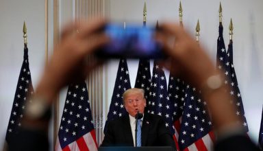 A reporter uses his mobile phone to record U.S. President Donald Trump at a news conference on the sidelines of the 73rd session of the United Nations General Assembly in New York, U.S., September 26, 2018. REUTERS/Carlos Barria