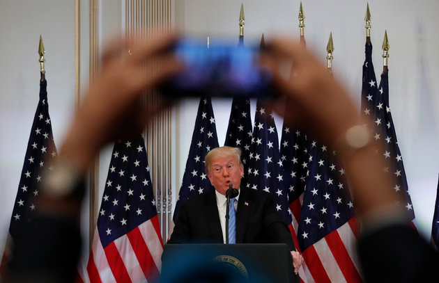 A reporter uses his mobile phone to record U.S. President Donald Trump at a news conference on the sidelines of the 73rd session of the United Nations General Assembly in New York, U.S., September 26, 2018. REUTERS/Carlos Barria