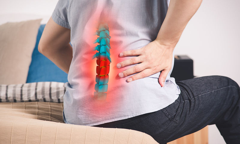 bigstock-Pain-In-The-Spine-A-Man-With--264256387