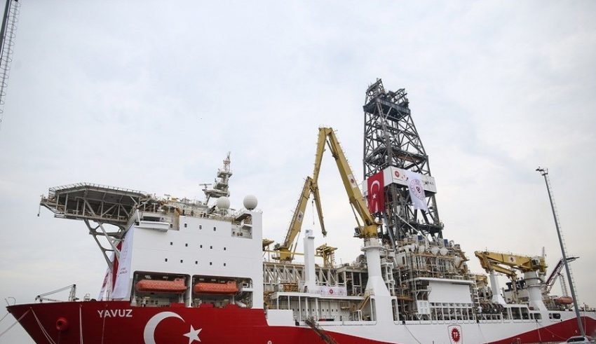epa07660241 Workers wait in front of the Turkish drilling vessel Yavuz at Dilovasi port in city of Kocaeli, Turkey, 20 June 2019. Turkey's second drilling ship will operate off the Karpas Peninsula to the northeast of the island of Cyprus. Yavuz will be determined by geology and geophysics studies of the vessel and it will take place at a depth of approximately 1,000 meters on the seabed and some 3,000 meters of drilling will be made, Bilgin said, adding that the ship will move to its second location once the first drill is completed.  EPA/ERDEM SAHIN