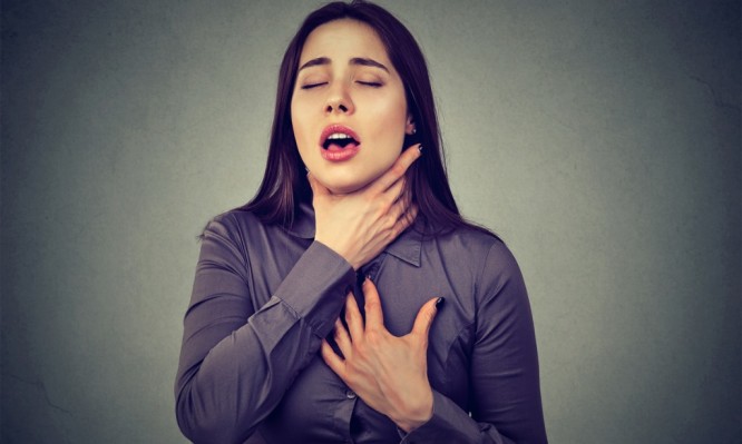woman-having-asthma-attack-or-choking-cant-breath-suffering-from-picture-id678985620-666x399
