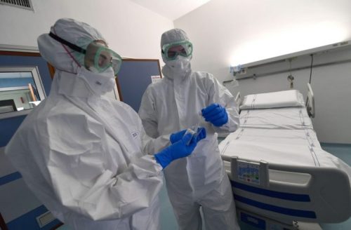 epa08179917 Medical staff of S. Martino hospital infectious disease department, with protective equipment on the isolation room, Genoa, Italy, 30 January 2020. The coronavirus, called 2019-nCoV, originating from Wuhan, China, has spread to all the 31 provinces of China as well as more than a dozen countries in the world. The outbreak of coronavirus has so far claimed at least 170 lives and infected more than 8,000 others, according to media reports.  EPA/LUCA ZENNARO