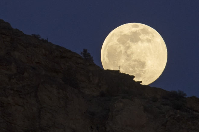 The full super snow moon rises, Saturday, Feb. 8, 2020, at Smith Rock State Park in Oregon. (AP Photo/Ted S. Warren)