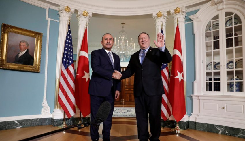 U.S. Secretary of State Mike Pompeo (R) shakes hands with Turkey's Foreign Minister Mevlut Cavusoglu before their meeting at the State Department in Washington, U.S., November 20, 2018. REUTERS/Yuri Gripas