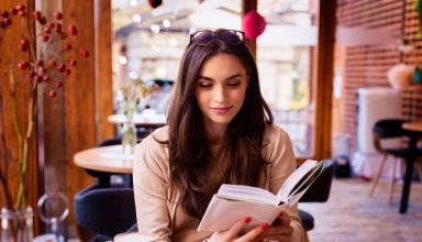 Portrait,Of,Beautiful,Woman,Reading,A,Book,While,Relaxing,In