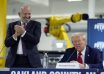 Republican presidential nominee former President Donald Trump arrives for a roundtable, Friday, Oct. 18, 2024, in Auburn Hills, Mich.,as Howard Lutnick, CEO of Cantor Fitzgerald applauds. (AP Photo/Evan Vucci)