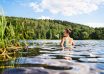 Swimming,In,Lake,In,Finland.,Woman,In,Summer,At,Beach.