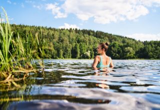 Swimming,In,Lake,In,Finland.,Woman,In,Summer,At,Beach.